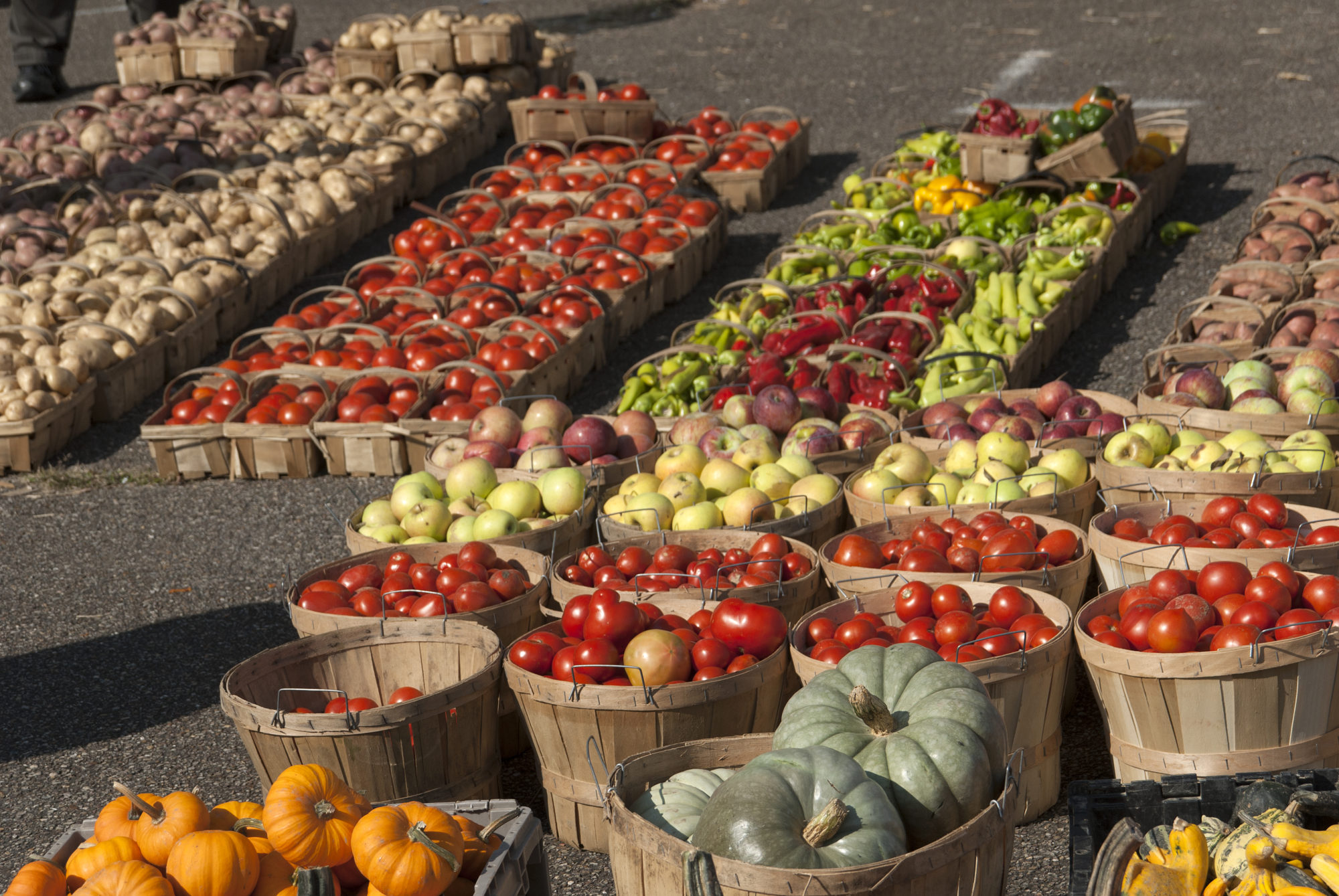 Baskets of various produce at a local farmers market